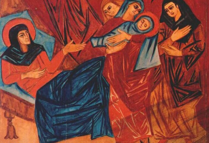 Cuadro cubista de Natalia Goncharova. Se ve la representación de la Navidad, el nacimiento del niño Jesús, en tonos rojos y azules y los ángulos característicos del cubismo.