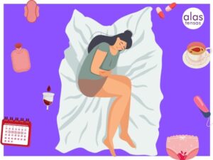 mujer en su cama doblada de dolor por endometriosis