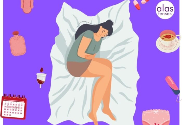 mujer en su cama doblada de dolor por endometriosis