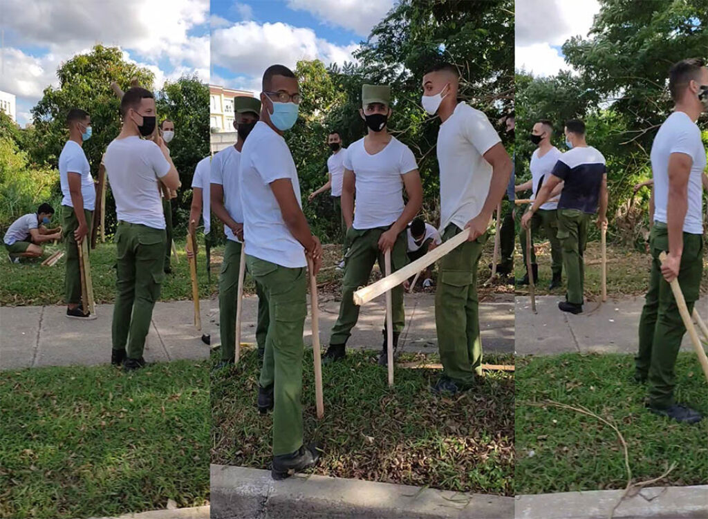 Jóvenes reclutas armados con palos para agredir a quienes protestan en Cuba. Imagen: Proyecto Inventario